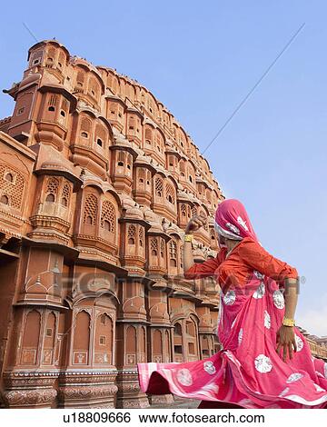 Low angle view of a female performer dancing in front of a palace, Hawa Mahal, Jaipur, Rajasthan, India View Large Photo Image Stock Photograph - Low angle view of a female performer dancing in front of a palace, Hawa Mahal, Jaipur, Rajasthan, India. Fotosearch