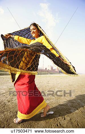Low angle view of a young woman dancing on the riverbank, Taj Mahal, Agra, Uttar Pradesh, India View Large Photo Image Stock Image - Low angle view of a young woman dancing on the riverbank, Taj Mahal, Agra, Uttar Pradesh, India. Fotosearch