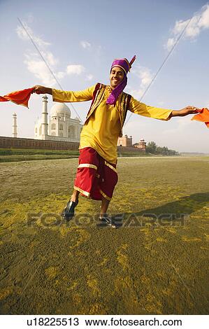 Portrait of a young man dancing on the riverbank, Taj Mahal, Agra, Uttar Pradesh, India View Large Photo Image Stock Image - Portrait of a young man dancing on the riverbank, Taj Mahal, Agra, Uttar Pradesh, India. Fotosearch