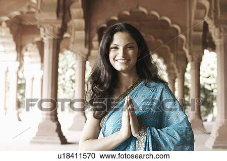 Stock Image - Portrait of a young woman smiling. Fotosearch