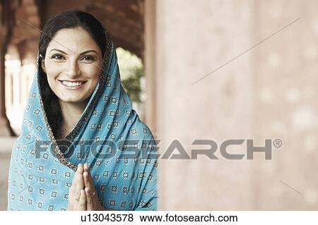 Portrait of a young woman smiling View Large Photo Image Stock Photo - Portrait of a young woman smiling. Fotosearch
