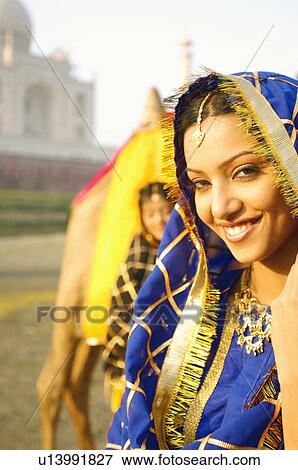 Portrait of a young woman smiling, Taj Mahal, Agra, Uttar Pradesh, India View Large Photo Image Stock Photo - Portrait of a young woman smiling, Taj Mahal, Agra, Uttar Pradesh, India. Fotosearch