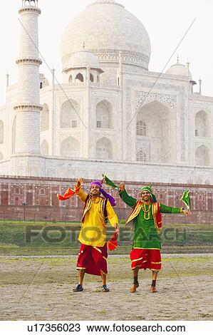 Two young men dancing in front of a mausoleum, Taj Mahal, Agra, Uttar Pradesh, India View Large Photo Image Stock Image - Two young men dancing in front of a mausoleum, Taj Mahal, Agra, Uttar Pradesh, India. Fotosearch