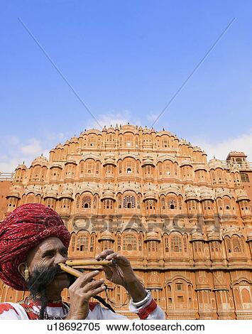 Close-up of a mature man playing two flutes with his nose in front of a palace, Hawa Mahal, Jaipur, Rajasthan, India View Large Photo Image Stock Photography - Close-up of a mature man playing two flutes with his nose in front of a palace, Hawa Mahal, Jaipur, Rajasthan, India. Fotosearch