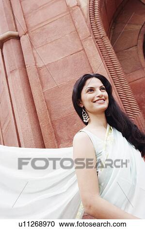 Close-up of a young woman smiling View Large Photo Image Stock Image - Close-up of a young woman smiling. Fotosearch