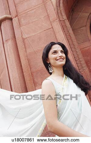 Close-up of a young woman smiling View Large Photo Image Stock Image - Close-up of a young woman smiling. Fotosearch