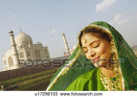 Close-up of a young woman smiling with her eyes closed, Taj Mahal, Agra, Uttar Pradesh, India View Large Photo Image Stock Image - Close-up of a young woman smiling with her eyes closed, Taj Mahal, Agra, Uttar Pradesh, India. Fotosearch
