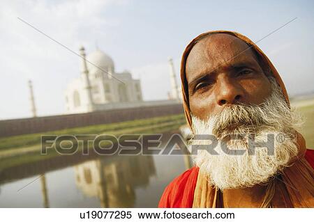 Portrait of a priest standing on the riverbank, Taj Mahal, Agra, Uttar Pradesh, India View Large Photo Image Stock Photography - Portrait of a priest standing on the riverbank, Taj Mahal, Agra, Uttar Pradesh, India. Fotosearch