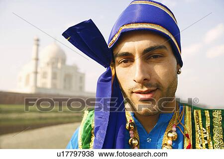 Portrait of a young man standing on the riverbank, Taj Mahal, Agra, Uttar Pradesh, India View Large Photo Image Stock Photo - Portrait of a young man standing on the riverbank, Taj Mahal, Agra, Uttar Pradesh, India. Fotosearch