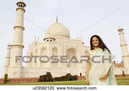 Portrait of a young woman standing in front of a mausoleum, Taj Mahal, Agra, Uttar Pradesh, India View Large Photo Image Stock Image - Portrait of a young woman standing in front of a mausoleum, Taj Mahal, Agra, Uttar Pradesh, India. Fotosearch