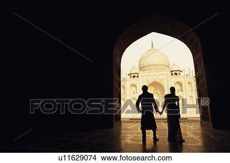 Silhouette of a couple standing in front of a mausoleum, Taj Mahal, Agra, Uttar Pradesh, India View Large Photo Image Picture - Silhouette of a couple standing in front of a mausoleum, Taj Mahal, Agra, Uttar Pradesh, India. Fotosearch