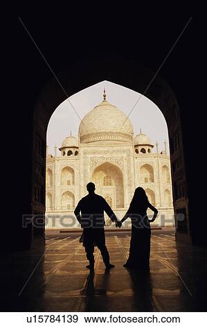 Silhouette of a couple standing in front of a mausoleum, Taj Mahal, Agra, Uttar Pradesh, India View Large Photo Image Stock Photo - Silhouette of a couple standing in front of a mausoleum, Taj Mahal, Agra, Uttar Pradesh, India. Fotosearch