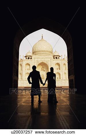 Silhouette of a couple standing in front of a mausoleum, Taj Mahal, Agra, Uttar Pradesh, India View Large Photo Image Stock Photo - Silhouette of a couple standing in front of a mausoleum, Taj Mahal, Agra, Uttar Pradesh, India. Fotosearch