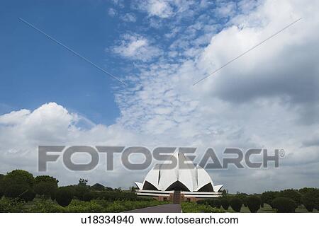 Woman standing in front of a temple, Lotus Temple, New Delhi, India View Large Photo Image Stock Image - Woman standing in front of a temple, Lotus Temple, New Delhi, India. Fotosearch