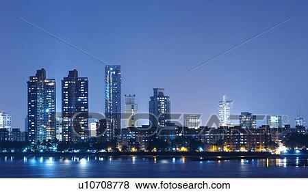 Stock Photo - Buildings lit up at dusk, Mumbai, Maharashtra, India. Fotosearch