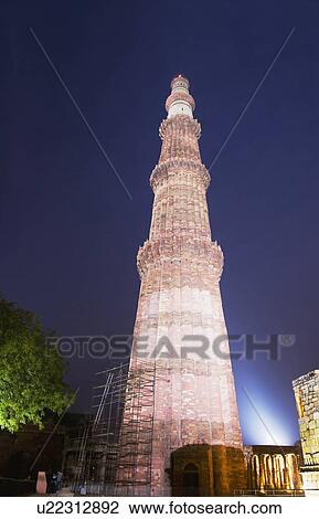 Low angle view of a monument lit up at night, Qutub Minar, Delhi, India View Large Photo Image Stock Image - Low angle view of a monument lit up at night, Qutub Minar, Delhi, India. Fotosearch