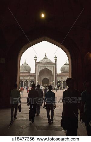 Rear view of a group of people entering a mosque, Jama Masjid, New Delhi, India View Large Photo Image Stock Photograph - Rear view of a group of people entering a mosque, Jama Masjid, New Delhi, India. Fotosearch