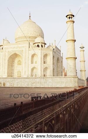 Stock Image - Tourist walking on a walkway, Taj Mahal, Agra, Uttar Pradesh, India. Fotosearch