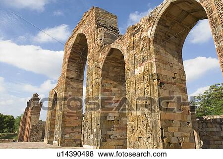 Stock Photo - Low angle view of an arched gateway, Qutab Minar, New Delhi, India. Fotosearch