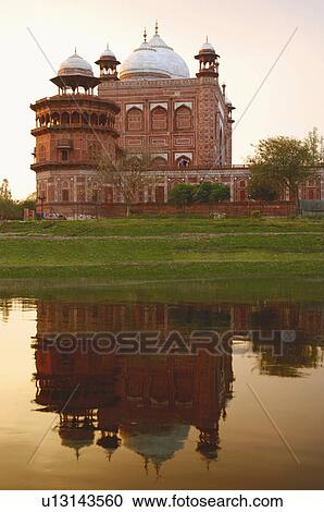 Stock Image - Reflection of a mausoleum in the river, Agra, Uttar Pradesh, India. Fotosearch