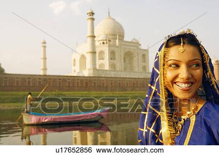 Close-up of a young woman smiling, Taj Mahal, Agra, Uttar Pradesh, India View Large Photo Image Stock Photograph - Close-up of a young woman smiling, Taj Mahal, Agra, Uttar Pradesh, India. Fotosearch