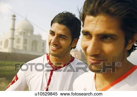 Close-up of two young men on the riverbank, Taj Mahal, Agra, Uttar Pradesh, India View Large Photo Image Stock Photography - Close-up of two young men on the riverbank, Taj Mahal, Agra, Uttar Pradesh, India. Fotosearch