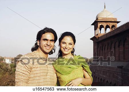 Portrait of a young couple smiling View Large Photo Image Stock Image - Portrait of a young couple smiling. Fotosearch