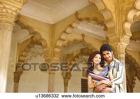 Portrait of a young man embracing a young woman View Large Photo Image Stock Image - Portrait of a young man embracing a young woman. Fotosearch