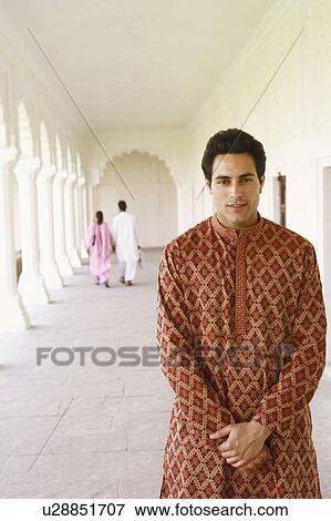 Portrait of a young man standing View Large Photo Image Stock Photo - Portrait of a young man standing. Fotosearch