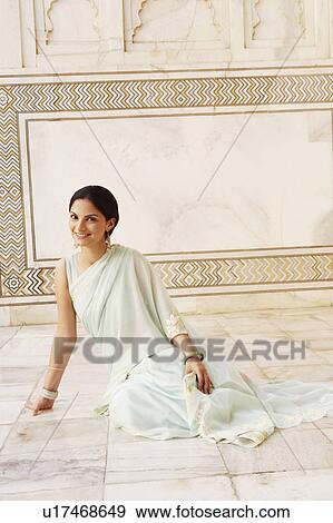 Portrait of a young woman sitting in a mausoleum, Taj Mahal, Agra, Uttar Pradesh, India View Large Photo Image Stock Photo - Portrait of a young woman sitting in a mausoleum, Taj Mahal, Agra, Uttar Pradesh, India. Fotosearch