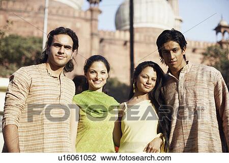 Portrait of two young couples standing View Large Photo Image Stock Image - Portrait of two young couples standing. Fotosearch
