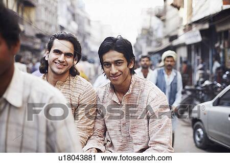 Portrait of two young men sitting in a rickshaw View Large Photo Image Stock Image - Portrait of two young men sitting in a rickshaw. Fotosearch
