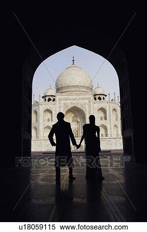 Silhouette of a couple standing in front of a mausoleum, Taj Mahal, Agra, Uttar Pradesh, India View Large Photo Image Stock Photography - Silhouette of a couple standing in front of a mausoleum, Taj Mahal, Agra, Uttar Pradesh, India. Fotosearch