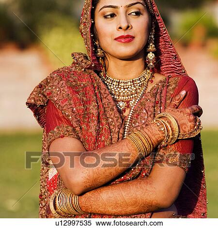 Bride in a traditional wedding dress View Large Photo Image Stock Photography - Bride in a traditional wedding dress. Fotosearch