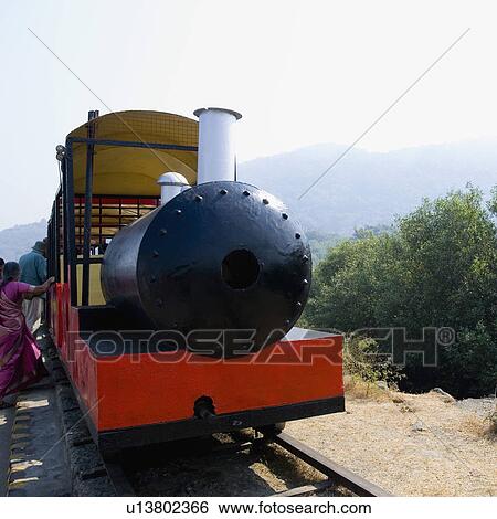 Close-up of an old steam train on a railroad track, Elephanta Caves, Mumbai, Maharashtra, India View Large Photo Image Stock Photograph - Close-up of an old steam train on a railroad track, Elephanta Caves, Mumbai, Maharashtra, India. Fotosearch