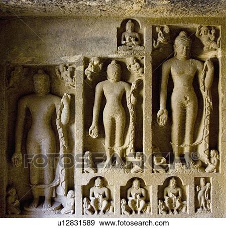 Stock Photo - Close-up of statues of Buddha carved on the wall of a cave, Kanari Cave, Mumbai, Maharashtra, India. Fotosearch