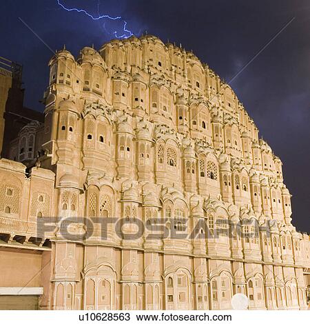 Stock Image - Low angle view of a palace at night, Hawa Mahal, Jaipur, Rajasthan, India. Fotosearch