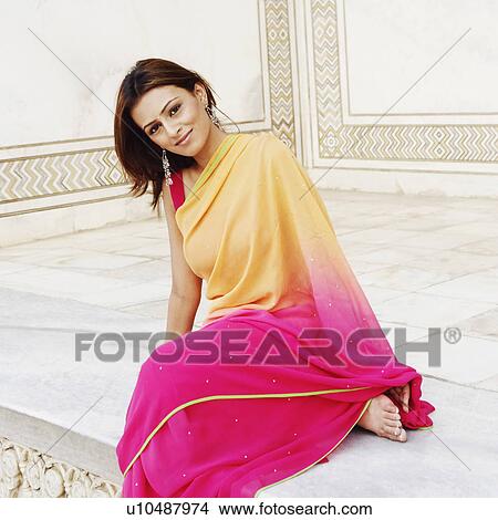 Portrait of a young woman sitting in a mausoleum, Taj Mahal, Agra, Uttar Pradesh, India View Large Photo Image Picture - Portrait of a young woman sitting in a mausoleum, Taj Mahal, Agra, Uttar Pradesh, India. Fotosearch