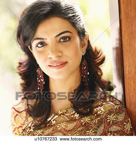 Stock Image - Portrait of a young woman smiling. Fotosearch