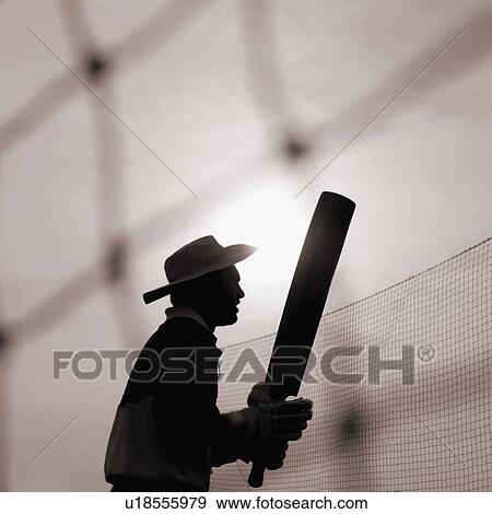 Silhouette of a man holding a cricket bat, Mumbai, Maharashtra, India View Large Photo Image Stock Photo - Silhouette of a man holding a cricket bat, Mumbai, Maharashtra, India. Fotosearch