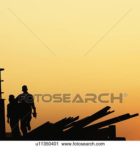 Silhouette of two workers at a dockyard, Mumbai, Maharashtra, India View Large Photo Image Stock Image - Silhouette of two workers at a dockyard, Mumbai, Maharashtra, India. Fotosearch