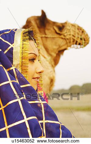 Close-up of a young woman in traditional clothing View Large Photo Image Stock Image - Close-up of a young woman in traditional clothing. Fotosearch