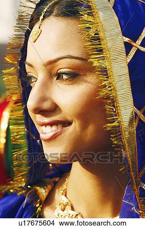 Picture - Close-up of a young woman smiling. Fotosearch