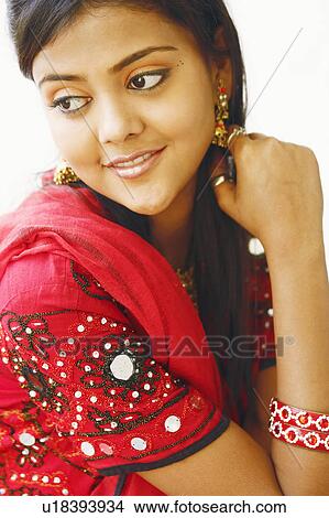 Close-up of a young woman smiling View Large Photo Image Picture - Close-up of a young woman smiling. Fotosearch