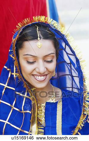 Stock Photograph - Close-up of a young woman smiling. Fotosearch