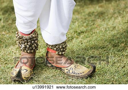 Low section view of a person leg wearing an ankle bracelet with bells, Jaipur, Rajasthan, India View Large Photo Image Stock Image - Low section view of a person leg wearing an ankle bracelet with bells, Jaipur, Rajasthan, India. Fotosearch