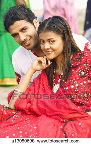 Stock Photo - Portrait of a young couple smiling. Fotosearch