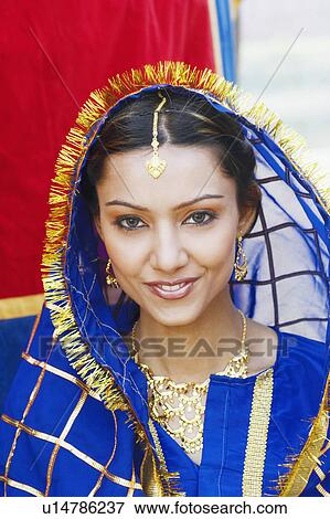 Portrait of a young woman smiling View Large Photo Image Stock Photo - Portrait of a young woman smiling. Fotosearch