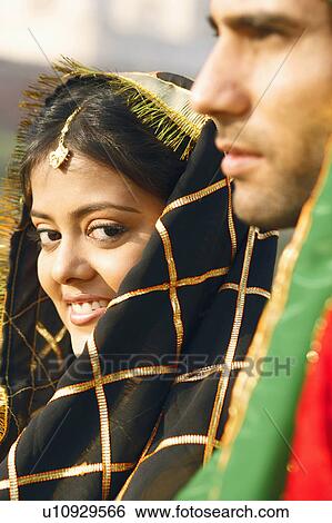 Portrait of a young woman with a young man View Large Photo Image Stock Photograph - Portrait of a young woman with a young man. Fotosearch