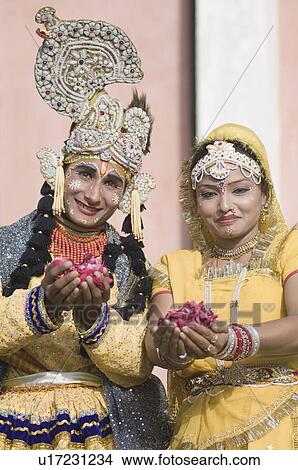 Portrait of two performers holding rose petals at an elephant festival, Jaipur, Rajasthan, India View Large Photo Image Picture - Portrait of two performers holding rose petals at an elephant festival, Jaipur, Rajasthan, India. Fotosearch